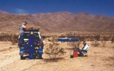 Seismic refraction survey at Apple Valley Landfill site, CA. Survey objectives were to map bedrock topography and a fault zone. The system shown is a EG&G Geometrics Es2401 Seismograph with a EG&G Geometrics Dynasource Vacum-Accelerated weight drop.